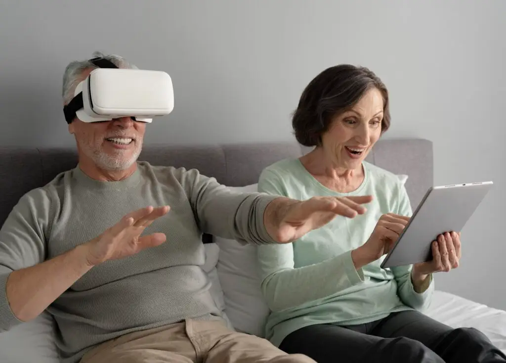 A man wearing virtual reality goggles and a woman using her tablet sitting on the couch
